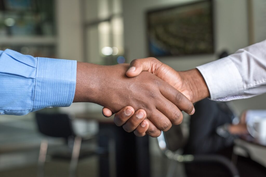 Advisor shaking hands with a client